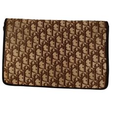 Add a touch of elegance to your outfit with this vintage Christian Diorissimo Flap Clutch. Made with durable canvas exterior material in a beautiful brown color, this clutch features the iconic Dior CD Logo in the product line. It's perfect for women who love to accessorize and can be utilized on any occasion. The clutch has a timeless style that matches any outfit. It's specifically designed for women who prefer a smaller bag for their daily essentials. The bag has a brand value of Dior, making Designer Brown Clutch For Evening, Formal Brown Clutch, Formal Rectangular Monogram Canvas Clutch, Designer Monogram Canvas Clutch, Luxury Brown Monogram Canvas Clutch, Luxury Brown Clutch For Travel, Brown Monogram Canvas Clutch, Brown Vintage, Daily Essentials