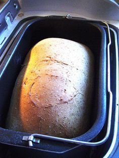 a loaf of bread sitting in an open suitcase