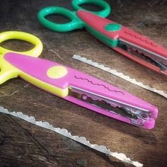 three pairs of scissors are sitting on a table