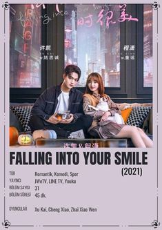 the poster for falling into your smile, which features two people sitting on a couch