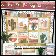 a display with posters and cactus plants in front of the sign that says do eef eff gghh it