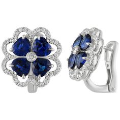 Delicate And Fun Earrings The earrings are 18K White Gold There are 3.60 Carats in Blue Sapphires Heart Shaped There are 0.56 Carats in White Diamonds F VS The earrings measure 0.50" Wide The earnings weigh 8.5 grams Blue Brilliant Cut Earrings For Anniversary, Blue Cluster Earrings Fine Jewelry, Fine Jewelry Blue Cluster Earrings, Blue Cluster Earrings For Anniversary, Blue Cluster Earrings In Fine Jewelry Style, Blue Clip-on Earrings Fine Jewelry, Brilliant Cut Sapphire Earrings For Anniversary, Luxury Sapphire Halo Earrings, Luxury Sapphire Earrings With Halo Design