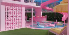 the inside of a barbie's house is pink and white with a water slide