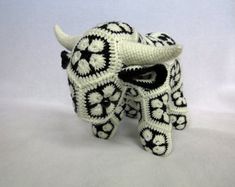 a white and black knitted animal with horns