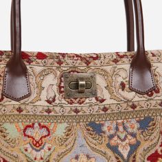 With a nod to the Victorian era, MCW’s freshly combines the classic and elegant design of the traditional carpet bag with a textural and tactile twist.The main body of the bags is made with thick chenille carpets. The handles and belts are genuine leather with heavy cotton canvas lining. The victorian carpet tote bag is closed with a high-quality vintage twist turn lock. The victorian carpet tote bag size is perfect for everyday use, It is made roomy for laptops and files. It features a zippered pocket (7-3/4 inches) with a leather cover and six slip pockets to organize your belongings. The large capacity is ideal for fitting your belongings while on work or during short holidays. Overall measurements:• Bottom Width: 14-1/8” • Top Width: 19''• Depth: 6-5/8'' • Height: 15-2/5''• Handle leng Vintage Tapestry Shoulder Bag With Leather Handles, Vintage Tapestry Tote Bag, Vintage Tapestry Bags With Leather Handles, Vintage Satchel Tote With Adjustable Handle, Tapestry Tote Shoulder Bag With Leather Handles, Vintage Brown Tapestry Satchel, Brown Tapestry Shoulder Bag With Leather Handles, Rectangular Tapestry Shoulder Bag With Leather Handles, Tapestry Tote Shoulder Bag With Adjustable Handle