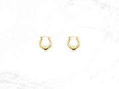 Crafted with real 14K Yellow Gold, our trendy small-sized Heart Hoop Earrings close with a latch backing. A staple for any jewelry wardrobe, our petite and polished heart hoops are perfect for any occasion. WHY YOU'LL LOVE IT * Trendy heart design perfect for every occasion * Beautifully crafted with Real 14K Gold * Never gold filled or plated HEART HOOP EARRINGS * Material: 14K Yellow Gold * Earring Size: 7 mm x 7 mm * Approximate Weight: 0.5 grams SHOP CONFIDENTLY * Hand Stamped for Authentici Small Hoop Earrings For Valentine's Day, Valentine's Day Tarnish Resistant Hoop Earrings, Valentine's Day Small Hoop Earrings, Everyday Hypoallergenic Hoop Heart Earrings, Everyday Hypoallergenic Heart Hoop Earrings, Tarnish Resistant Hoop Huggie Earrings For Valentine's Day, Valentine's Day Tarnish Resistant Hoop Huggie Earrings, Hypoallergenic Small Hoop Heart Earrings, Small Hoop Earrings With Heart Charm For Anniversary