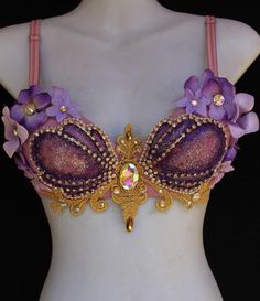 the bra is adorned with purple flowers and pearls