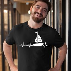 Sailing Heartbeat Shirt, Sailing Lover Tee, Katamaran Shirt, Captain T-Shirt, Sailing Boat TShirt, Sailing EKG Tee, Man Sailing Mens T-Shirt A T-shirt with a print will be the perfect gift idea!  HOW TO ORDER  1. Select the shirt style 2. Select the size (We suggest you choose the size you usually wear) 3. Select the shirt color 4. Select the quantity, Please buy carefully, each product is made to order. If you have question, please send us a message. We would be happy to help you :D  SPECIFICATION  T-shirt made of 100% high quality soft cotton Weight 150-185g/m2 The prints are vinyl  CARE INSTRUCTIONS  Turn the shirt inside out before washing do not bleach, do not dry clean, wash with similar items, do not iron directly on the design. In our store you will find things for many occasions s Nautical Crew Neck T-shirt For Boating, Summer Boating T-shirt With Short Sleeves, Summer Short Sleeve T-shirt For Boating, Nautical Short Sleeve Top In Sail Color, Nautical Style Sail Color Short Sleeve Tops, Sail Colored Nautical T-shirt For Boating, Summer Boating T-shirt With Crew Neck, Summer Crew Neck T-shirt For Boating, Casual Crew Neck T-shirt For Boating