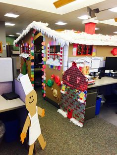 an office cubicle decorated for christmas with gingerbread man