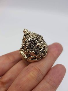 Beautifully made Thai amulet Phra Rahu Ring , by Portan Koly Anomo.  Phra Rahu will bring up your downfall faith, ward away dangers and prevent curses and black magic, keep protection. Those who have difficult or many obstacles in life should worship Phra Rahu, as he will make your life, your career smoother and bring success to you. Free size, adjustable ring. Carved Amulet Jewelry For Collectors, Engraved Amulet Jewelry For Good Luck, Carved Bronze Pendant Jewelry, Bronze Carved Spiritual Jewelry, Spiritual Carved Brass Jewelry, Handmade Symbolic Jewelry For Blessing, Collectible Carved Bronze Jewelry, Bronze Carved Collectible Jewelry, Bronze Carved Jewelry Gift