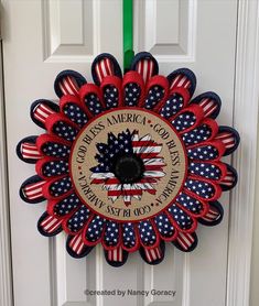 a patriotic wreath with the words god's america and an american flag on it