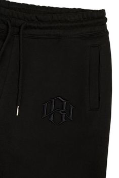 Premium 400gsm Heavyweight Sweatpants crafted with a cozy brushed interior, highlighted with a 3d embroidered monogram. Standard fit, with flat-knit gusset for added flexibility and reverse flatlock stitching. Pre-shrunk and treated to ensure minimal shrinkage. 3D Embroidered Monogram Logo Heavyweight Cotton Reverse Flatlock Stitching Adjustable Drawstrings Waist Single Welt Rear Pocket Model is 5'11" and 202 lb. wearing size Medium. Sweatpants Black, W Logo, Embroidered Monogram, Black Sweatpants, Pocket Model, Monogram Logo, Drawstring Waist, Sweatpants, Stitching