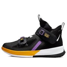 The Nike LeBron Soldier 13 EP 'Lakers' is a bold and stylish sneaker that is perfect for any activity. It features a traditional Magic Strap design, a daring color-blocking design, and James' personal logo on the upper. The black and white-university gold colorway is inspired by the Lakers, James' team. The rubber sole ensures durability and comfort, making it perfect for any activity. Whether you're playing basketball or just running errands, the Nike LeBron Soldier 13 EP 'Lakers' is the perfect sneaker. (SNKR/Men's/High Top/Basketball/Lebron James/Gift Recommend) Basketball Lebron James, Perfect Sneakers, Playing Basketball, Mens High Tops, Nike Lebron, Personal Logo, Strap Design, Stylish Sneakers, Lebron James