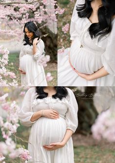 a pregnant woman wearing a white dress and holding her belly in front of pink flowers