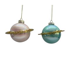 two christmas ornaments hanging from strings on a white background, one is blue and the other is pink