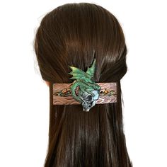 "This fierce dragon skull hair clip will be the perfect addition to your cosplay look.  Give a great gift of a unique hair accessory with handmade dragon art.  This dragon barrette  has been sculpted with polymer clay measuring 4 inches long and 3\" wide (from the top of the wings to the bottom of the skull). The base of the hair clip is made of textured clay hand painted in metallic bronze with filigree scroll detail with green and red crystals.  On the reverse, the 3 inch hair barrette style c Skull Hair Clip, Fierce Dragon, Textured Clay, Dragon Skull, Thick Hair Styles Medium, Polymer Clay Dragon, Hair Accessories Pins, Unique Hair Accessories, Witch Shop