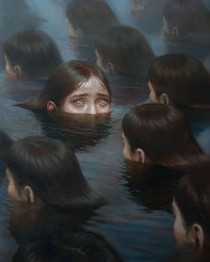 a group of people in the water with their heads submerged