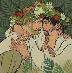 two men with flowers on their heads kissing each other in front of leaves and plants