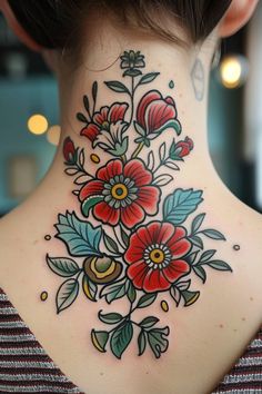 a woman's neck with flowers on it