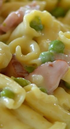 pasta with ham, peas and cheese on it