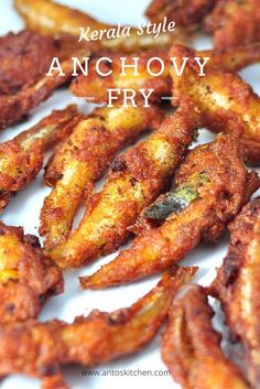 some fried food on a white plate with the words, kerala style anchovy fry