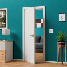 a living room with blue walls and white furniture in the corner, including an open door that leads to a small sitting area