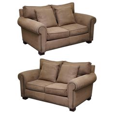 two brown couches sitting next to each other