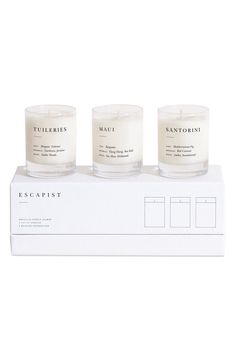 three candles sitting on top of a box