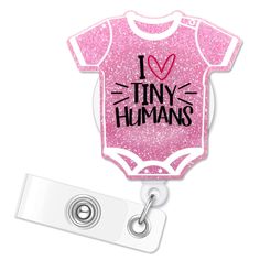 a pink baby bodysuit with the words i love tiny humans on it and a name tag