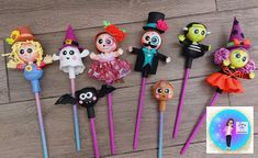 there are many halloween themed toothbrushes on the table, including one girl and two boys