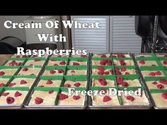 some raspberries are sitting in trays on a table with the words cream of wheat with raspberries freeze dried