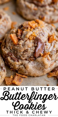 Peanut butter butterfinger cookie with baking bits, on a baking sheet lined with parchment paper. Peanut Butter Cookies Halloween, Dessert Ring Recipes, Peanut Butter Heath Cookies, Crumbl Butterfinger Cookie, Gourmet Drop Cookies, Stuffed Cookie Recipes Middle, Homemade Baked Goods Desserts, Desserts That Look Like Real Food, Best Halloween Cookie Recipes