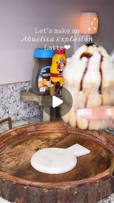 an ice cream sundae sitting on top of a wooden tray