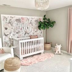 a baby's room decorated in white and pink