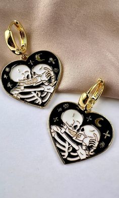 Are you looking for the perfect skeleton earrings for someone special this gifting season? Or a unique pair of Skeleton kissing Halloween hoop earrings to spoil your bestie or significant other? Made with tarnish-free stainless steel and bright enamel, my skeleton lovers earrings set is the perfect compliment to any outfit idea! My Halloween jewelry for women is a great gift idea for any special occasion to all the women in your life. You can't go wrong when gifting my skeleton kissing jewelry t Edgy Jewelry For Halloween Gift, Metal Skull Print Jewelry For Halloween, Punk Style Halloween Jewelry Gift, Emo Metal Earrings For Gift, Emo Style Metal Earrings For Gift, Black Novelty Jewelry For Valentine's Day, Emo Metal Earrings For Halloween, Gothic Jewelry With Skull Print For Gift, Gothic Hoop Earrings Gift