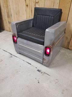 the back end of a truck bed with its lights on and it's door open