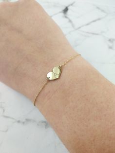 "14K 9K Small heart charm bracelet with Engraved Initial, Solid gold bracelet, Custom Monogram gold bracelet, Personalized gold bracelet, Valentine's Gift, Gift for her, 14K Rose Gold bracelet, Bridesmaid gift, Bridal jewelry, Dainty gold bracelet, FREE EXPRESS SHIPPING Delicate minimalist 14K solid gold bracelet with a small heart charm engraved with one or two initials. A wonderful and thoughtful gift for you and your loved ones! Infinity bracelet: https://www.etsy.com/listing/608986075 Boho e Heart Bracelet For Best Friend And Mother's Day, Heart Bracelet For Mother's Day And Best Friend Gift, Personalized Heart Name Bracelet For Best Friend, Heart Charm Double Heart Jewelry For Best Friend, Double Heart Charm Jewelry For Best Friend, Engraved Heart Bracelet For Friendship On Valentine's Day, Engraved Heart Bracelet For Valentine's Day Friendship, Personalized Heart Bracelet For Friendship, Engraved Heart Bracelet For Friendship