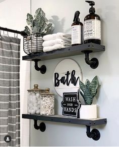 a bathroom with two shelves holding various items