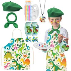 a little boy wearing an apron and hat with dinosaurs on it