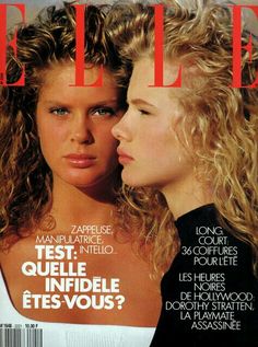 two women on the cover of a magazine, one is looking at another woman's face