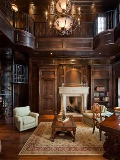 an elegant living room with wood paneling and chandelier