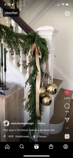 the christmas decorations are hanging from the banister