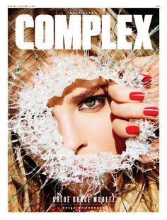 the cover of complex magazine featuring a woman's face through shattered glass with her hands