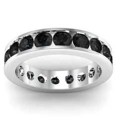 a white gold ring with black diamonds