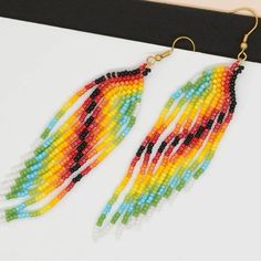 Multi Colored Beaded Tassel Earrings, Brand New Multicolor Casual Jewelry With Tassels, Yellow Fringe Earrings For Beach, Multicolor Fringe Beaded Earrings With Round Beads, Multicolor Fringe Beaded Drop Earrings, Multicolor Beaded Fringe Drop Earrings, Multicolor Fringe Dangle Earrings, Multicolor Fringe Dangle Jewelry, Yellow Fringe Beaded Earrings With Round Beads, Yellow Beaded Earrings With Fringe