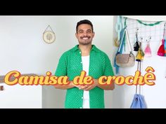 a man standing in front of a sign that says canis de croche