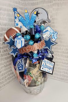 a gift basket filled with sports items and congratulations stickers for the team's football player