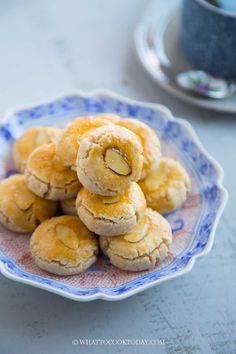 a blue and white plate filled with cookies