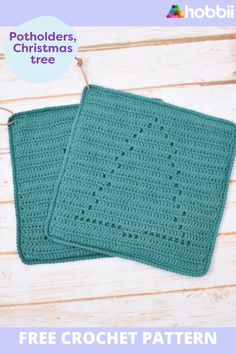 two crocheted potholders sitting on top of a wooden table