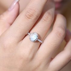 A Vintage Style Moonstone Diamond Ring Known as the lover's stone, the moonstone is a symbol of friendship and love, making moonstone rings a perfect gift for a loved one; it is also the June birthstone, symbolizing health, wealth, and longevity. Made of 925 Sterling Silver: Delicate, Durable, and Hypoallergenic Made of 925 sterling silver, this moonstone diamond ring is delicate, durable, and hypoallergenic. You will see a stamp where it applies. Sterling silver is hypoallergenic, so it’s excel Moon Shaped Rose Cut Diamond Jewelry Gift, Elegant Moonstone Ring With Center Stone In Sterling Silver, Elegant Sterling Silver Moonstone Ring With Center Stone, Elegant Moonstone Ring With Center Stone, Heirloom White Moonstone Ring With Rose Cut Diamonds, Rose Cut Diamonds Moonstone Round Jewelry, Celestial Halo Setting Promise Ring Jewelry, Heirloom Moonstone Ring With Rose Cut Diamonds For Anniversary, Heirloom Moonstone Ring With Rose Cut Diamonds For Promise